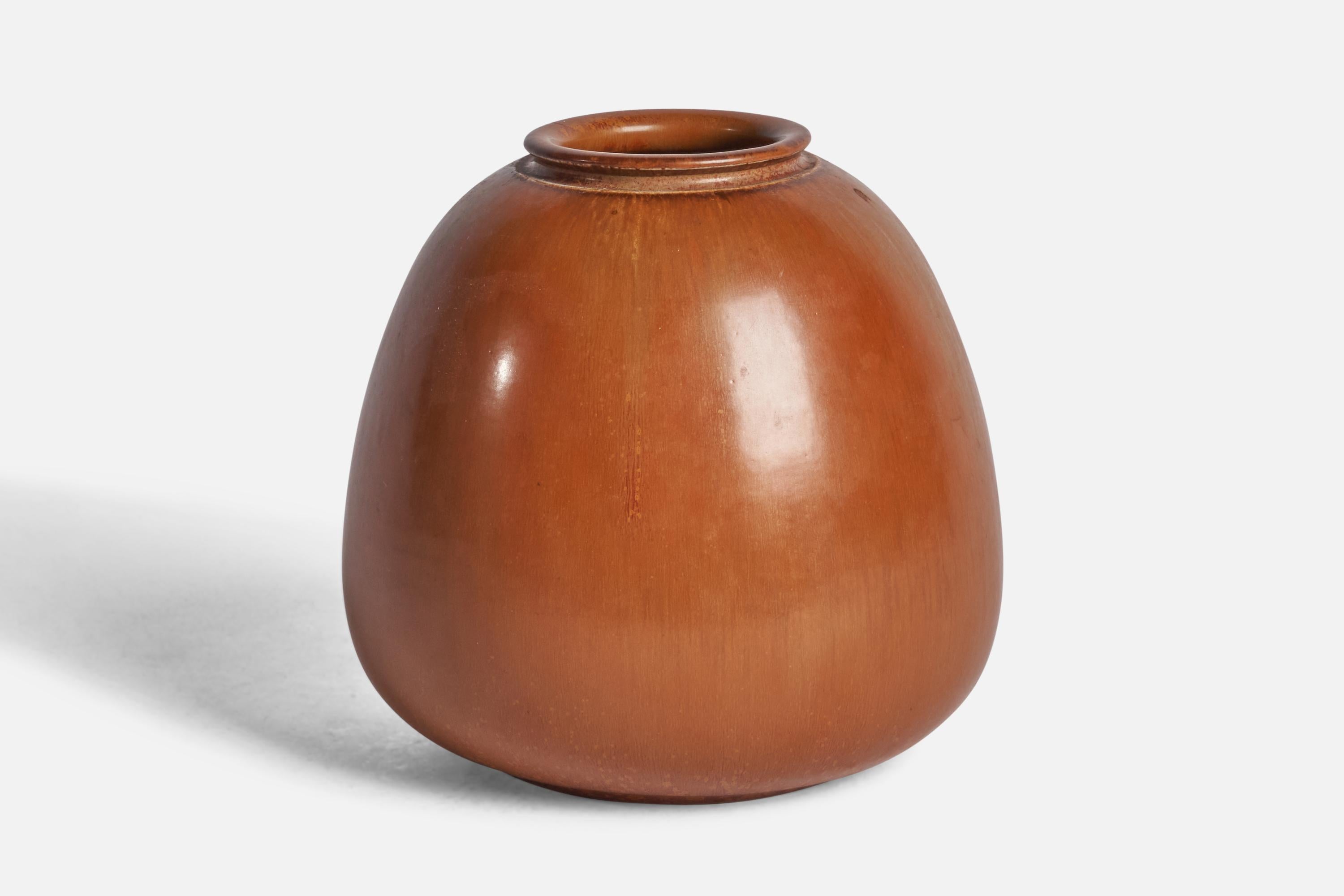 A brown-glazed stoneware vase designed by Eva Staehr-Nielsen and produced by Sax, Denmark, c. 1950s.

“SAXBO OANMART 14” on bottom