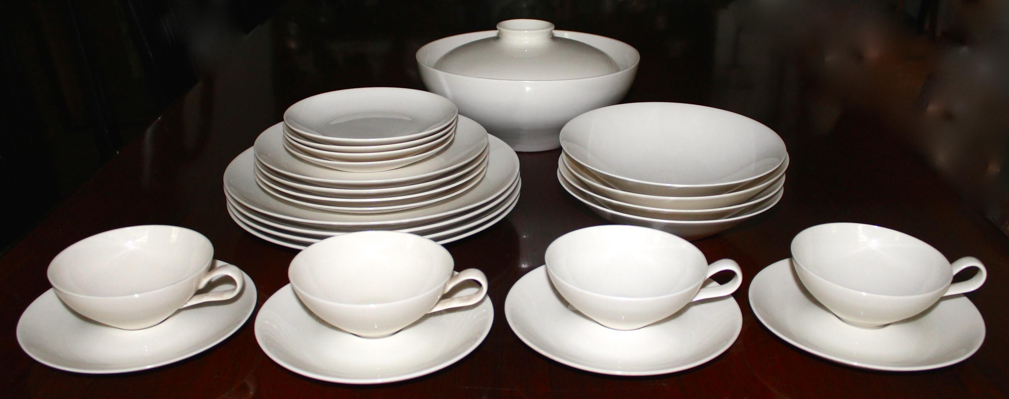The set consists of 25 pieces: Four cups and four saucers 6 5/8