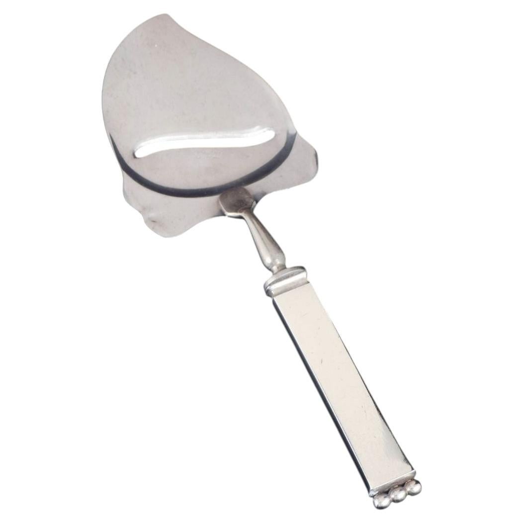 Evald Nielsen. Art Deco cheese slicer in silver and stainless steel, 1930s