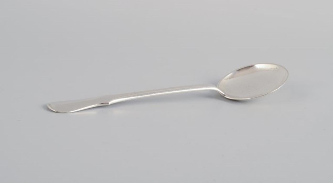 Evald Nielsen, Danish silversmith. Two hammered sugar spoons in Danish 830 silver. One spoon model number 14.
Approx. 1920s
Marked.
In excellent condition.
Longest spoon: L 14.8 cm.