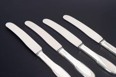 Evald Nielsen. Set of four dinner knives in silver and stainless steel, 1930s