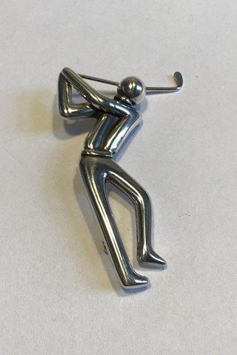 Evald Nielsen sterling silver brooch golf player.

Measures: H 6,0 cm/2.36 inches Weight 14.2 gr/0.50 oz.