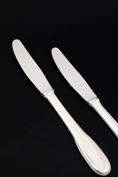 Evald Nielsen. Two dinner knives in sterling silver and stainless steel. 1930s