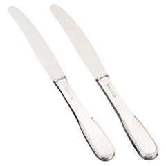 Evald Nielsen, dos cuchillos de mesa de plata y acero inoxidable. Años 30