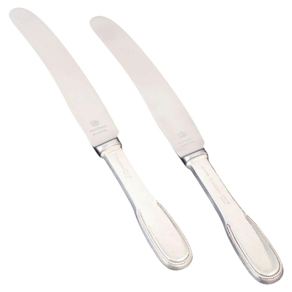 Evald Nielsen. Two lunch knives in sterling silver and stainless steel.