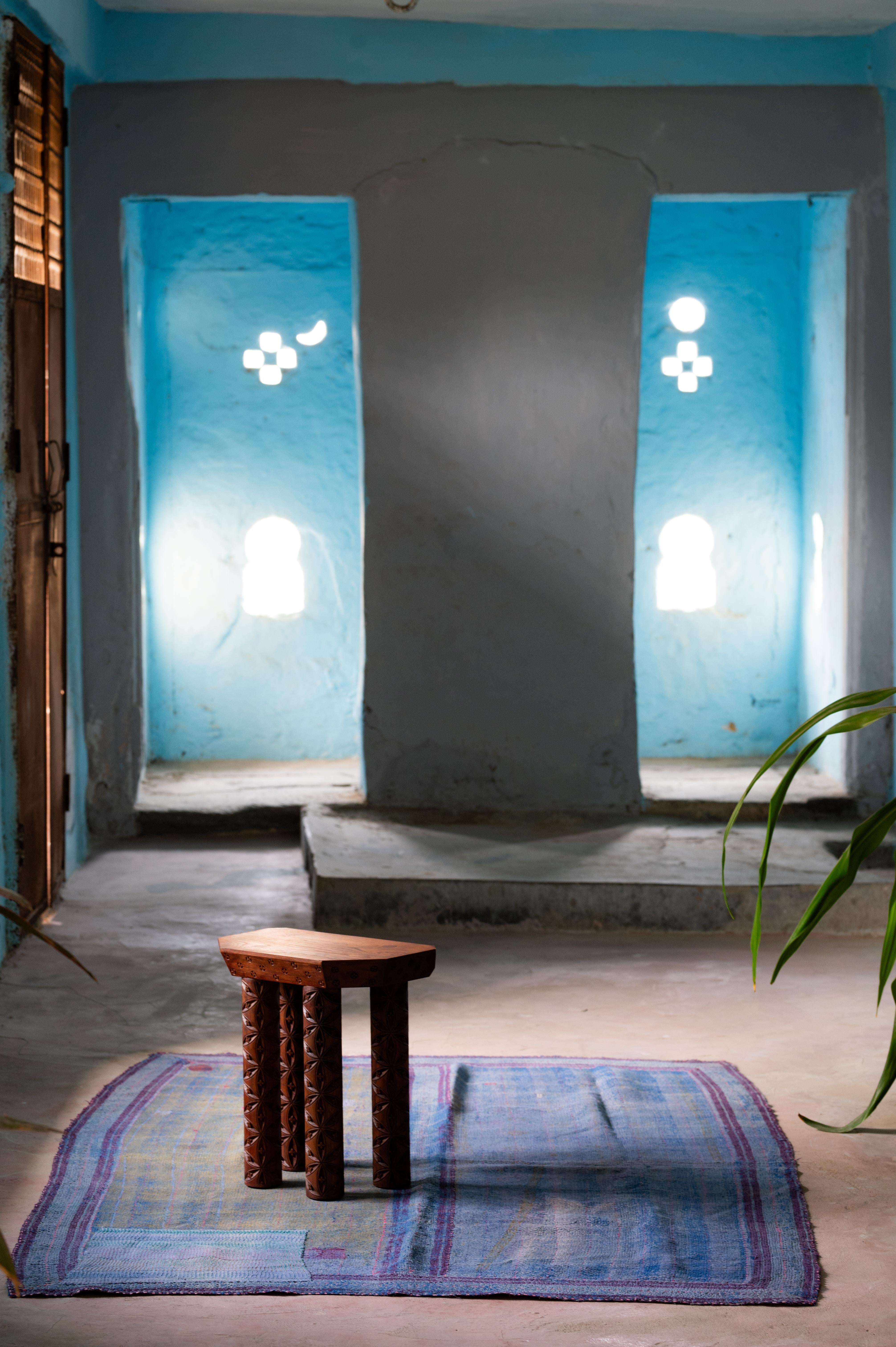 The Evam stool is made from solid reclaimed teak and carved by hand by a local master craftsman in Udaipur, India.  The carving displays the “hexafoil” or “flower of life” pattern which can be found as far back as 6000 years in various cultures