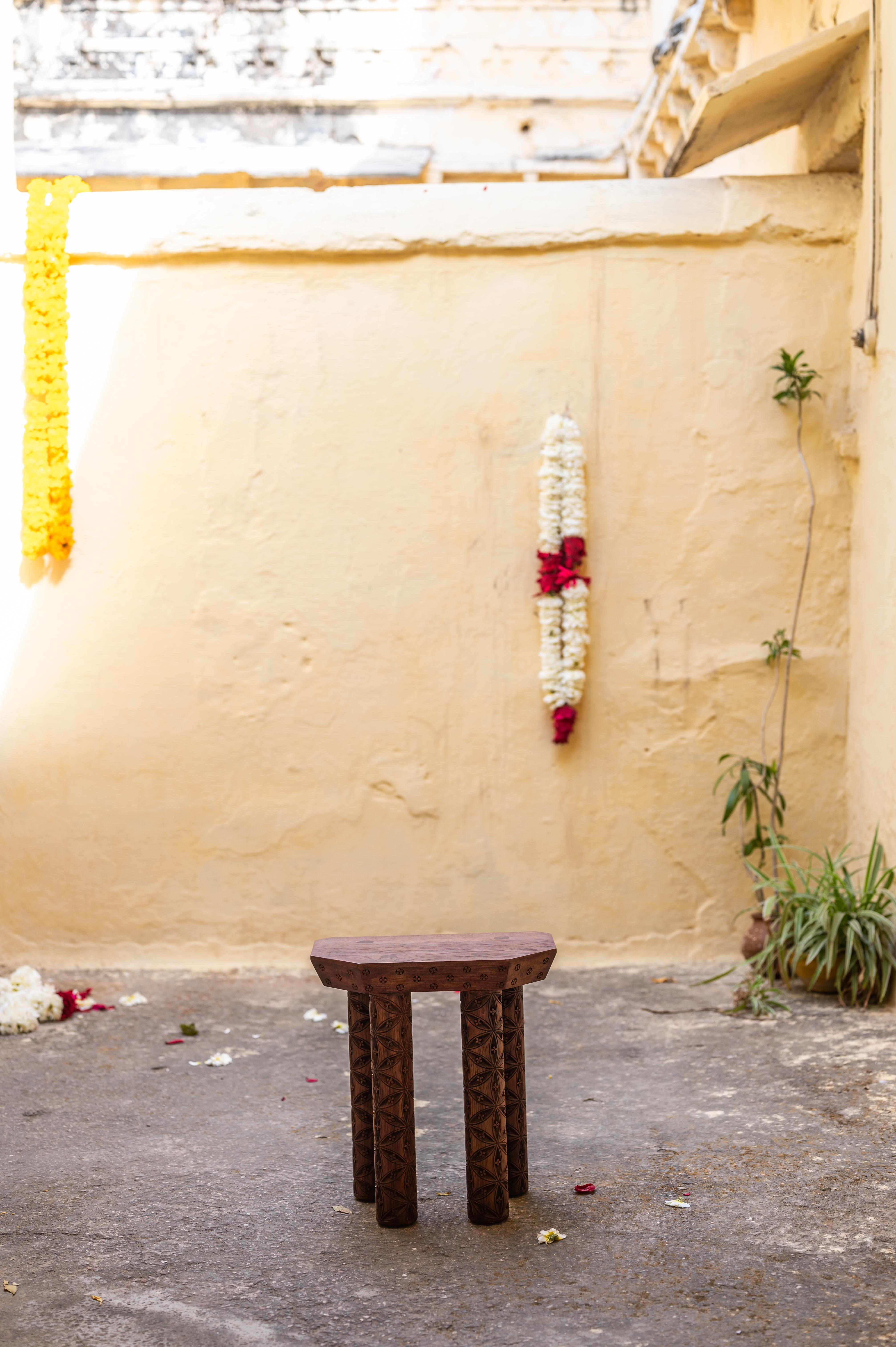 Evam Stool in Oiled Teak by Evam
Dimensions: D 22.9 x W 38.1 x H 40.6 cm. 
Materials: Oiled teak.

Available in oiled or blackened teak. Prices may vary. Please contact us.

The Evam stool is made from solid reclaimed teak and carved by hand by a