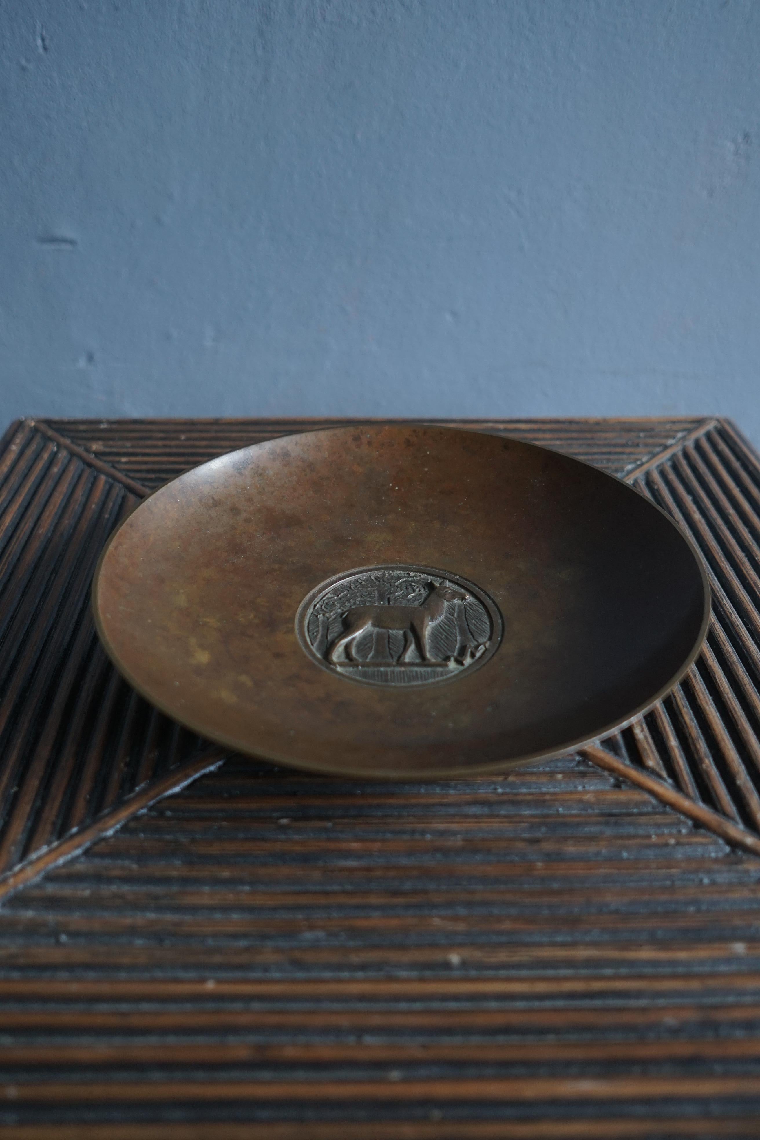 Bronze Art deco dish/charger by Danish artist Evan Jensen from the 1930's in a beautiful original condition, the dish is signed Evan Jensen Copenhagen Bronze and has model number 320.

The dish has a very decorative image of a deer on the