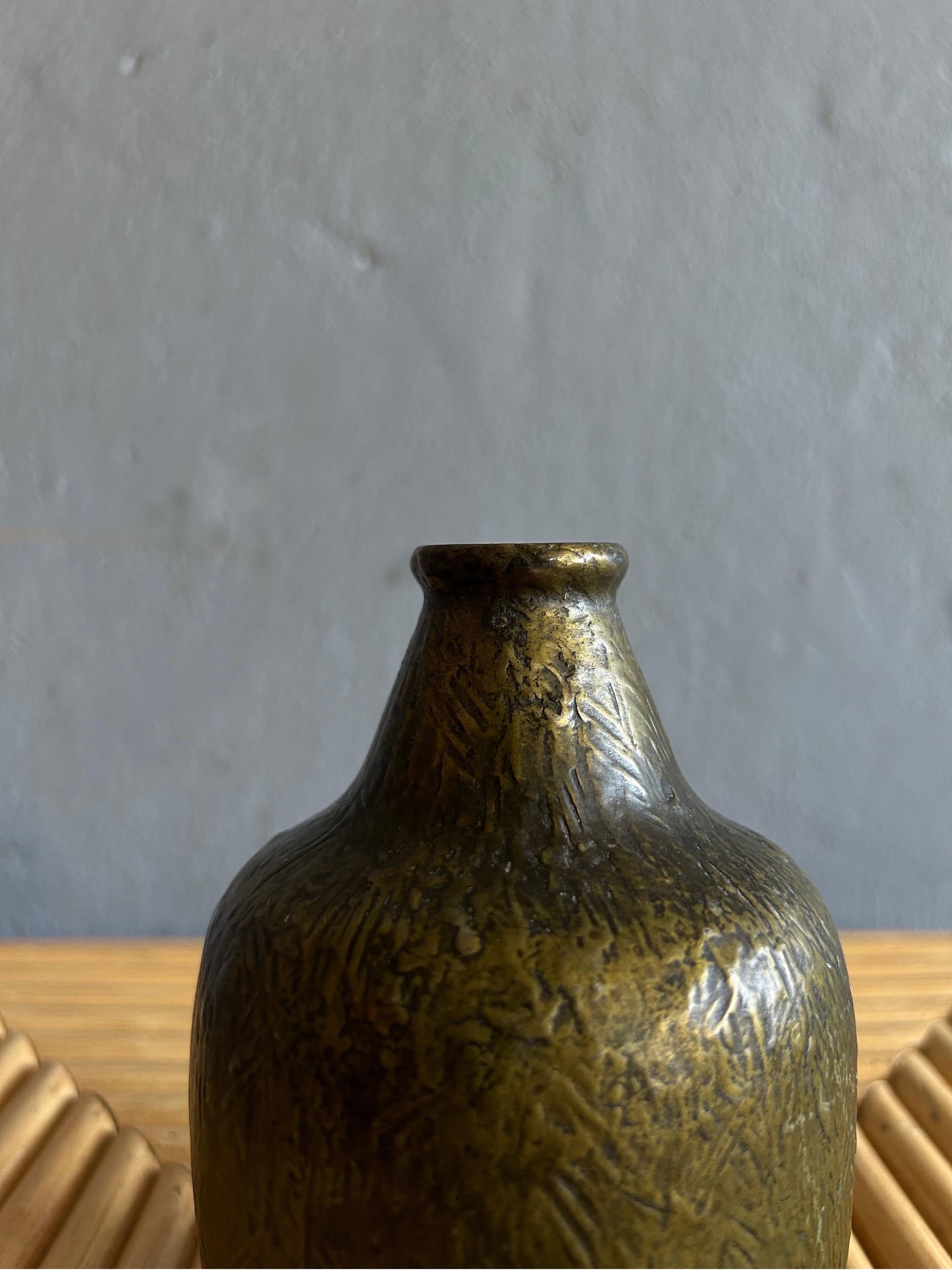 Rare bronze vase attributed Evan Jensen made in Denmark in the 1930s.
The vase is made by a unknown danish caster called Antika but is a typical Evan Jensen shaped vase and has typical Evan Jensen detail.

The vase is in good condition with a