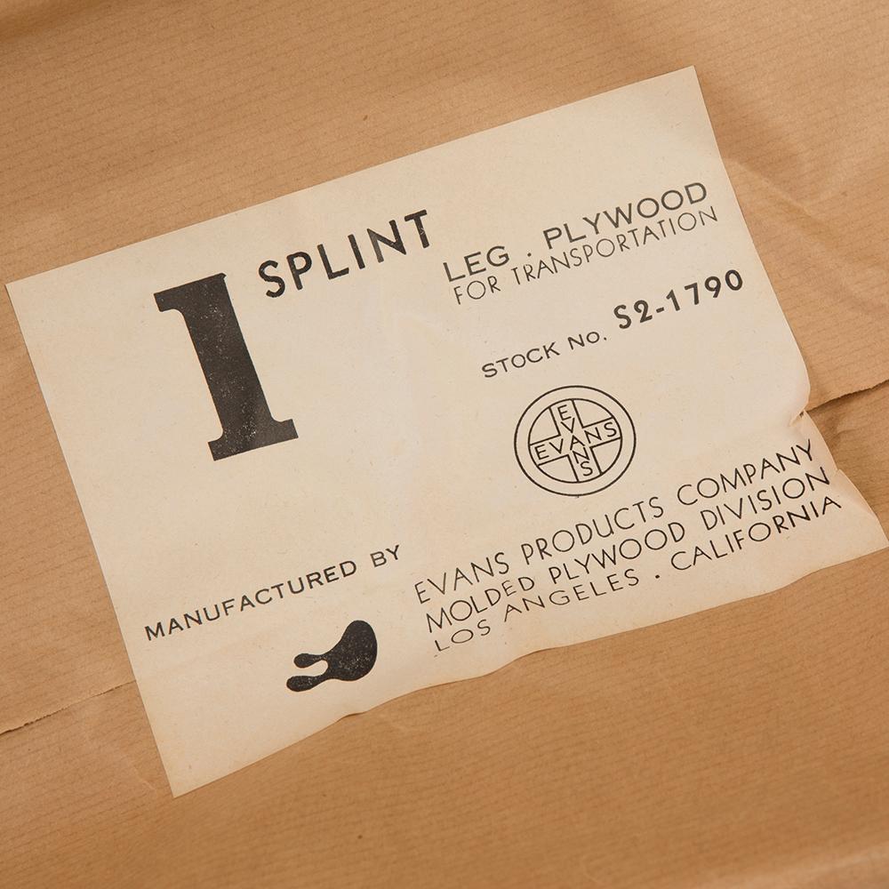 A wrapped example of the iconic Eames splint produced by Evans Products for the US Navy in 1942. This is a great collector's piece to own and features completely intact wrapping.
