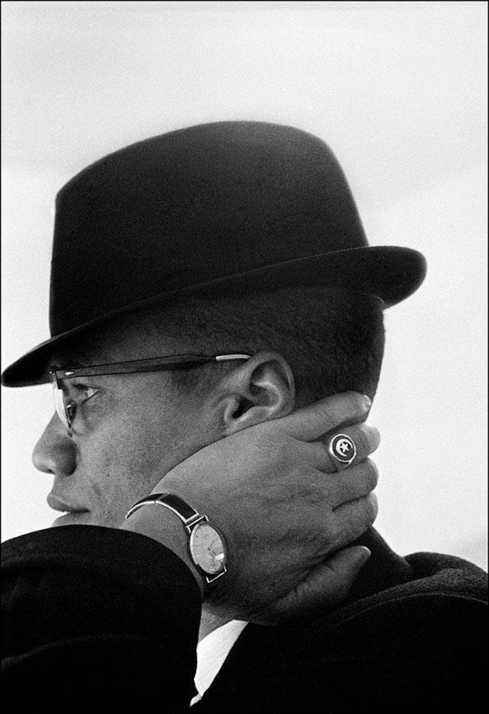Eve Arnold Black and White Photograph - Malcolm X during his visit to enterprises owned by Black Muslims. 1962