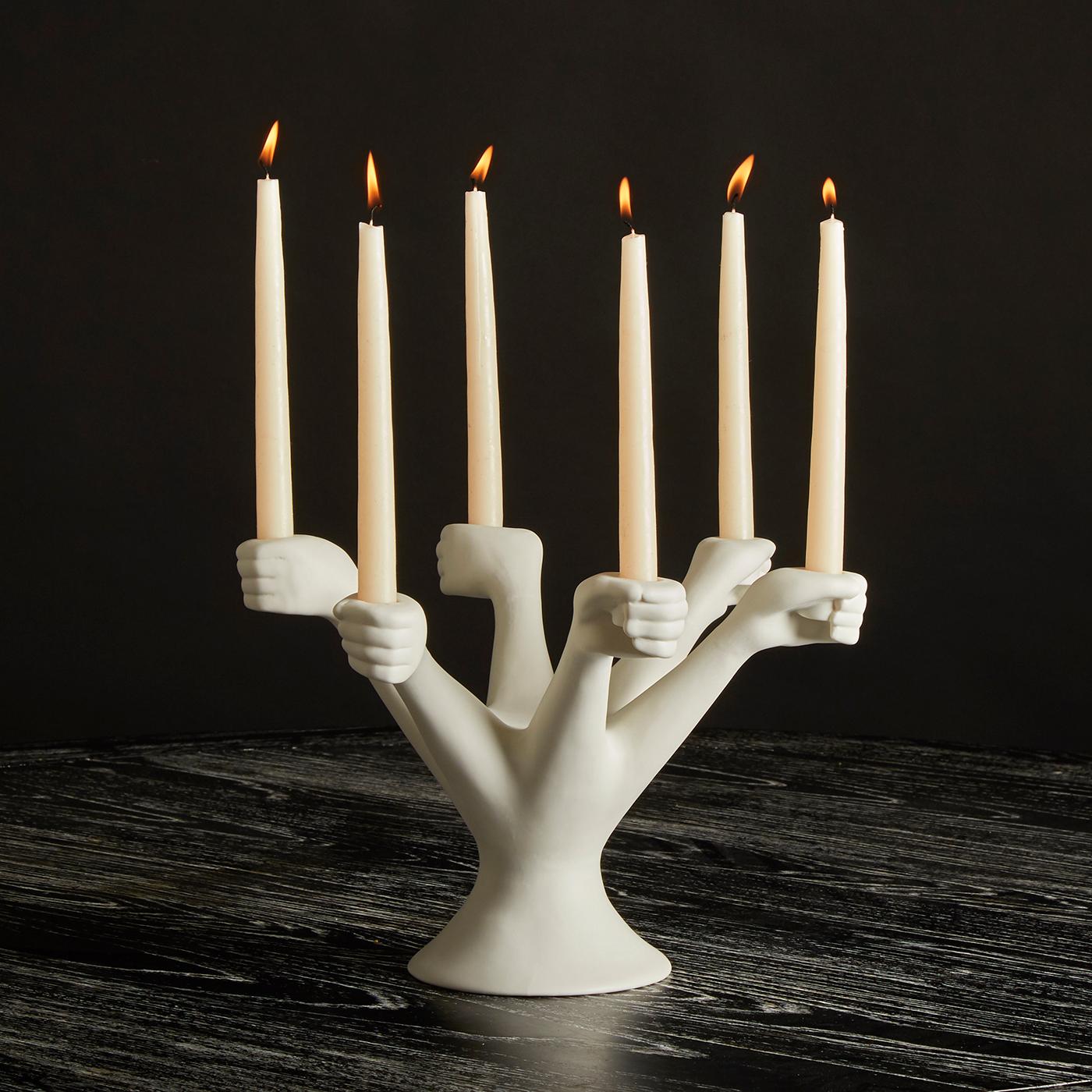 Porcelain Reverie. A heavy dose of temptation to your next dinner party —our Eve-inspired riff on the neoclassical candelabra. Crafted from high-fired porcelain, six surreal hands rise up from the base to grip taper candles. Its generous scale and