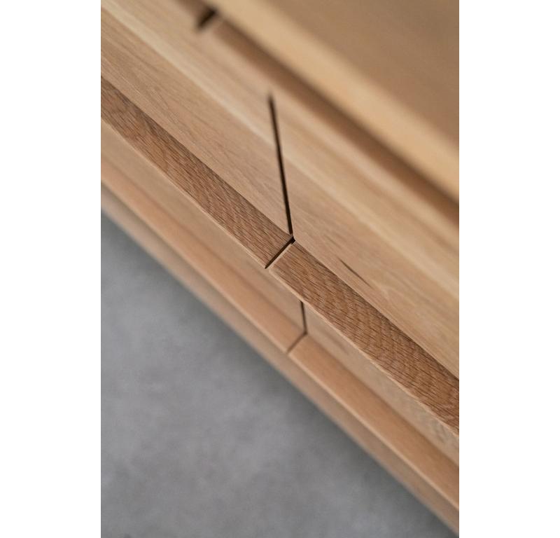The Eve Dresser is handmade locally in Los Angeles, California. The solid oak casing borders the push-release drawers beautifully. A thin, tapered oak handle is featured on each drawer. The Eve Dresser has nine drawers to maximize