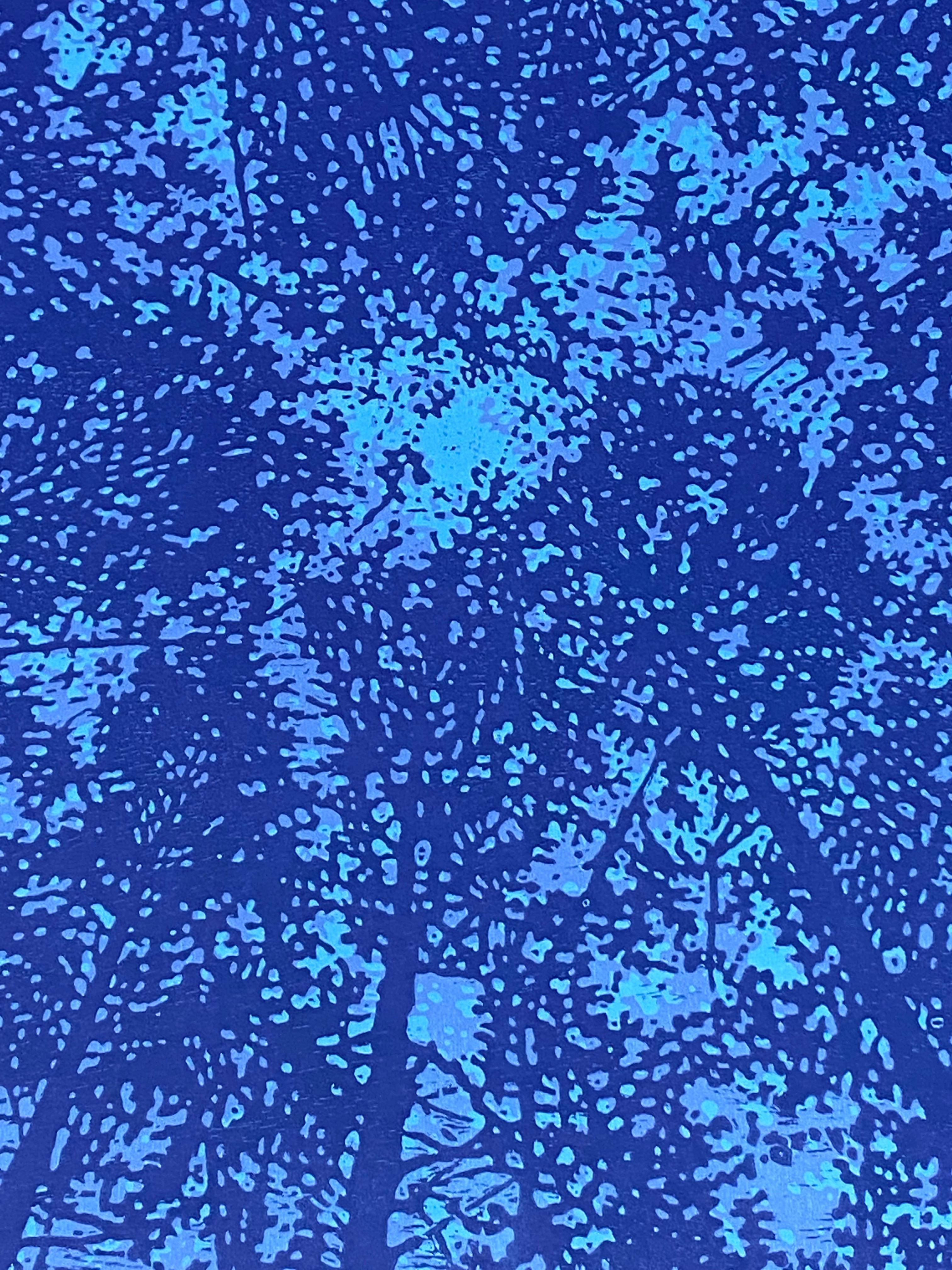 This square woodcut print on paper evokes the peacefulness of looking upwards through a forest canopy in a symmetrical pattern composed of the silhouettes of trees in shades of dark navy, pale blue, and bright,. The monotype brings to mind the