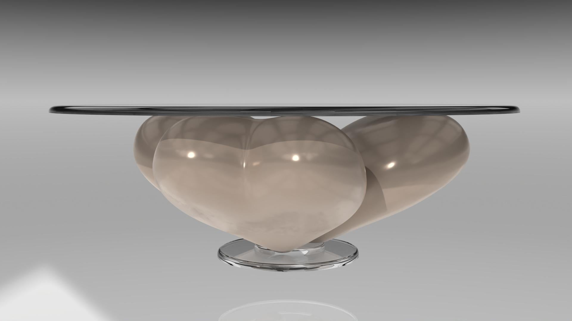 In-House Design, una casa di design visionaria, svela un capolavoro che incarna l'essenza dell'amore e dell'eleganza. Questo tavolino scultoreo è più di un semplice mobile: è una dichiarazione. Simbolo dell'amore nella sua forma più raffinata e