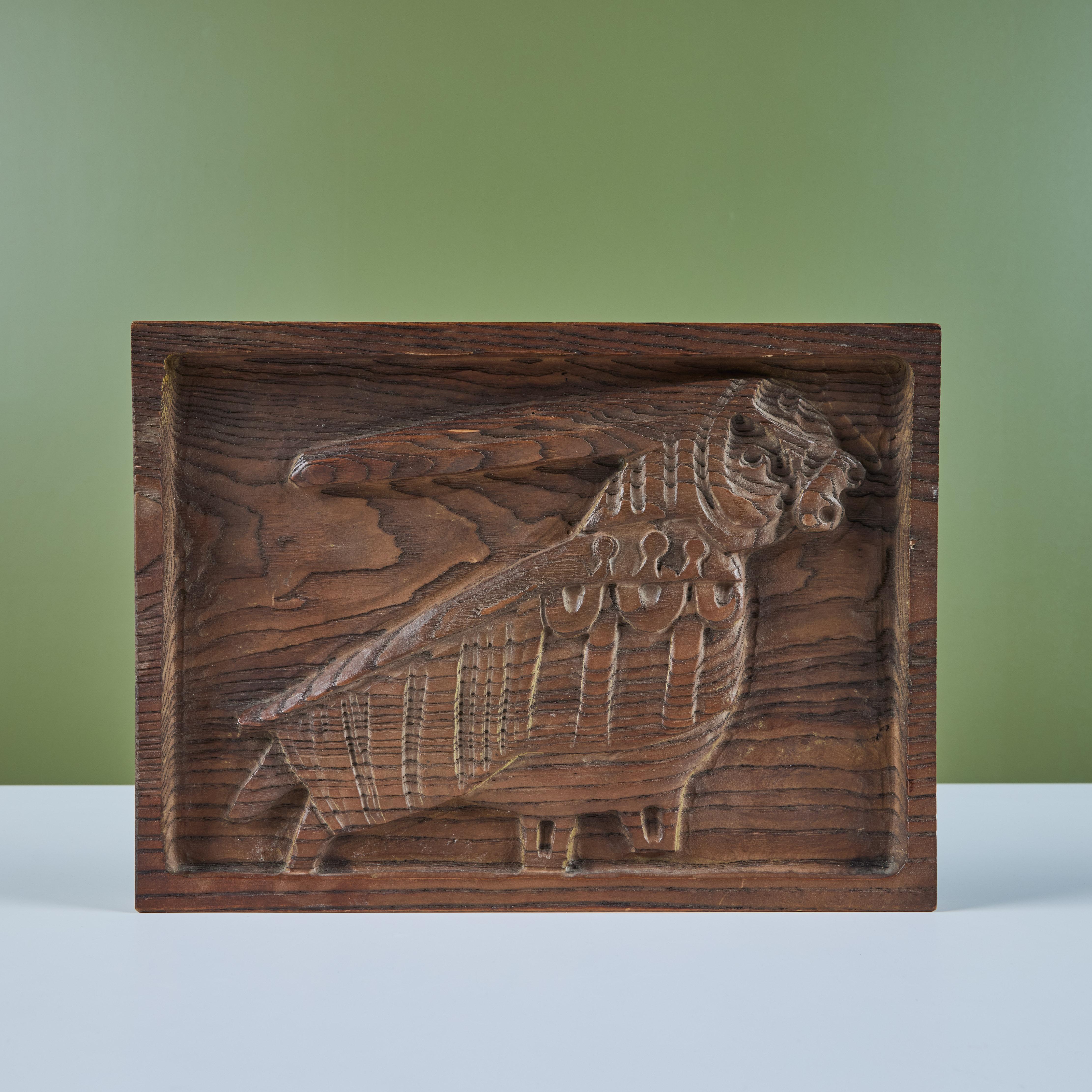 Wood carving by California artist, Evelyn Ackerman, c.1960s. This carving features a hand carved creature.

Dimensions
12.5