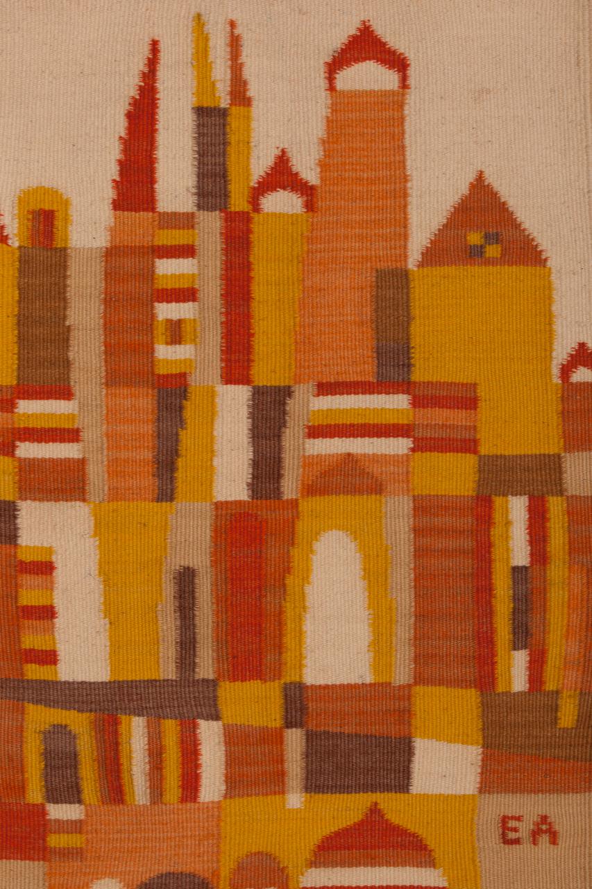 A highly collectible handmade wool cityscape tapestry by renowned designer, Evelyn Ackerman, known for her California Mid-Century Modern designs. Slight variation in yarn dyeing gives these buildings added dimension. This piece is signed 
