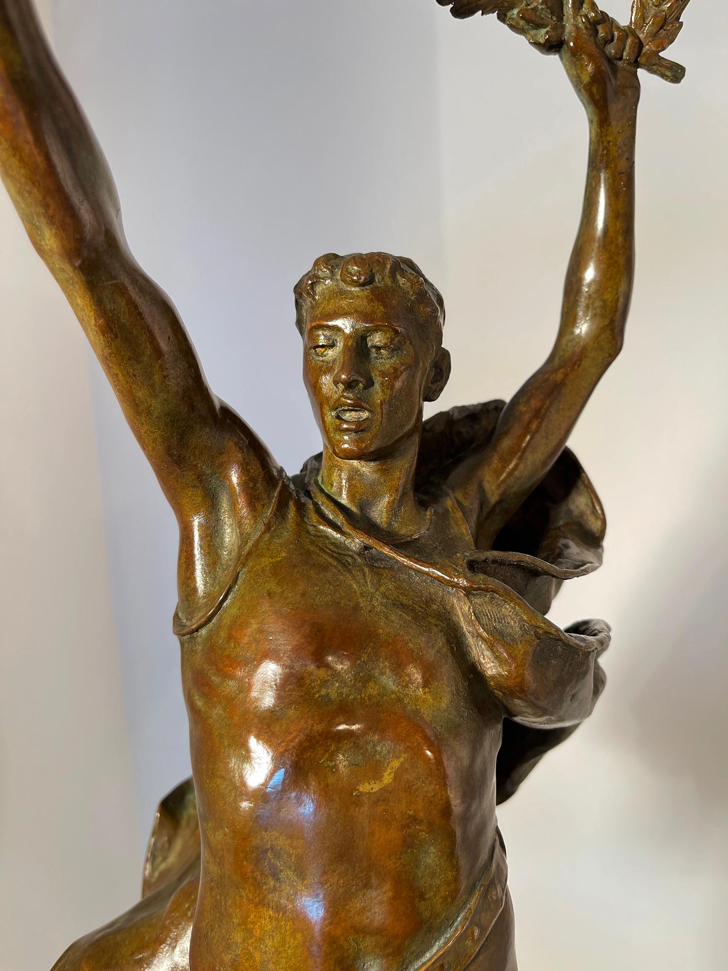 Victory - Athletic Young Man in Classical Pose,  ( Female Sculptor ) - Gold Nude Sculpture by Evelyn Beatrice Longman