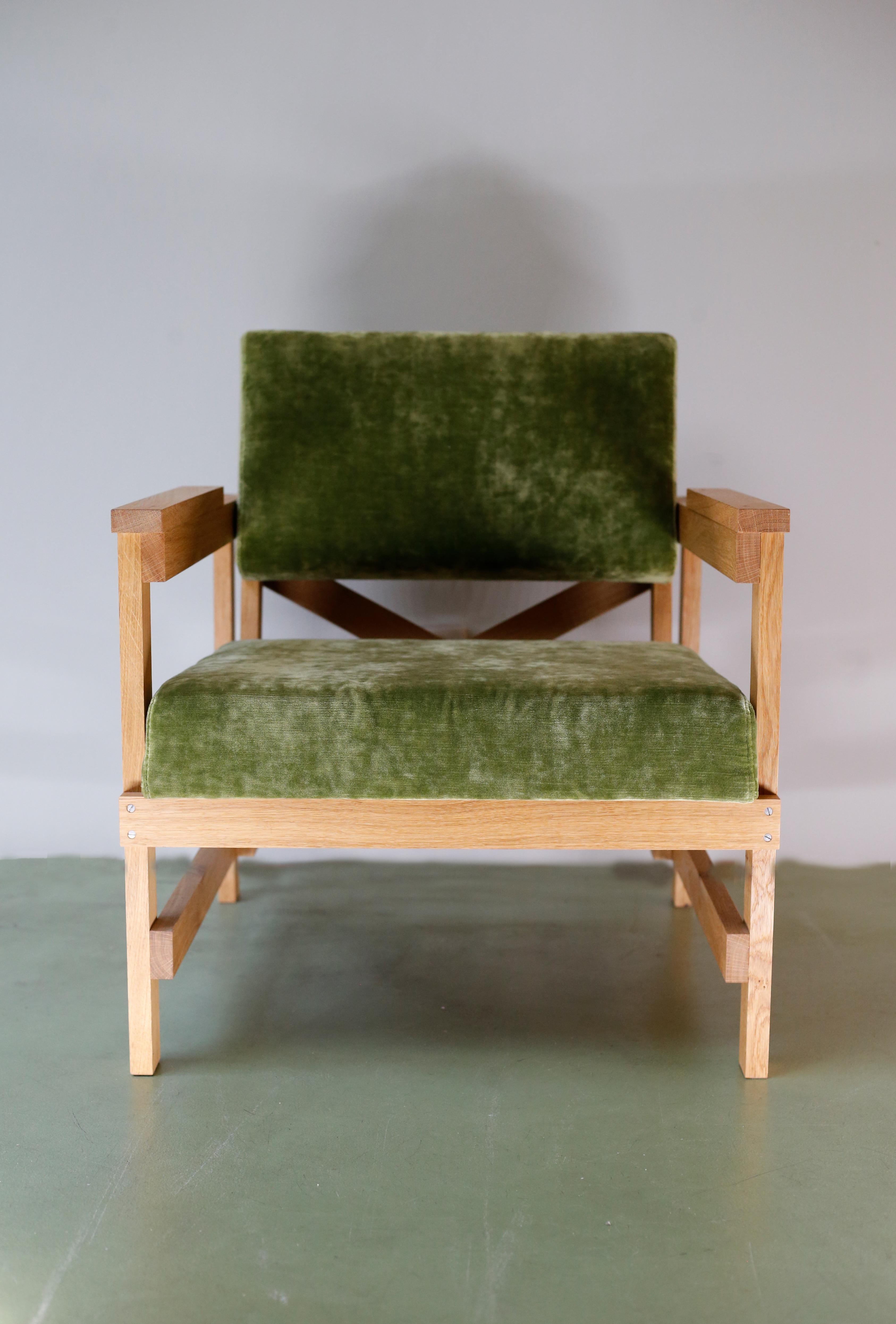 This fauteuil is made from solid oak wood and upholstered in a lush velvet fabric by us to create a unique product. 
The slats that are used all have the same width and thickness. The back arrow that continues, creates a triangle that offers