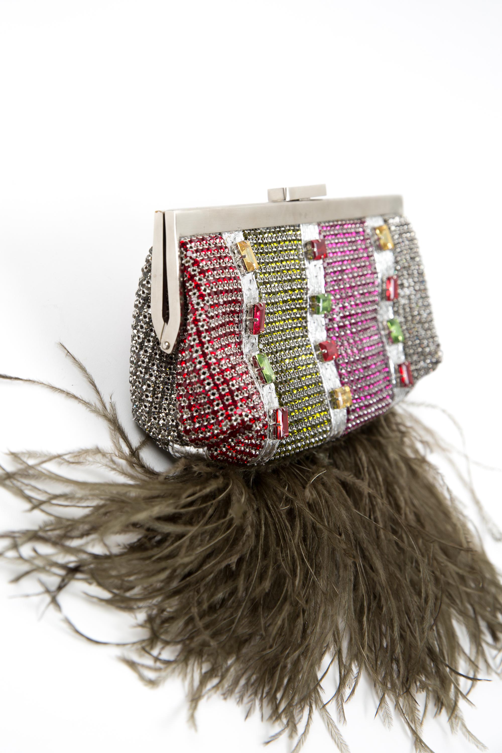 Maia N. evening cluth bag featuring fancy & multicolour strass, a silver-tone claps opening, inside camel suede leather and feathers at the bottom.
In good vintage condition. 
We guarantee you will receive this gorgeous minaudière as described and