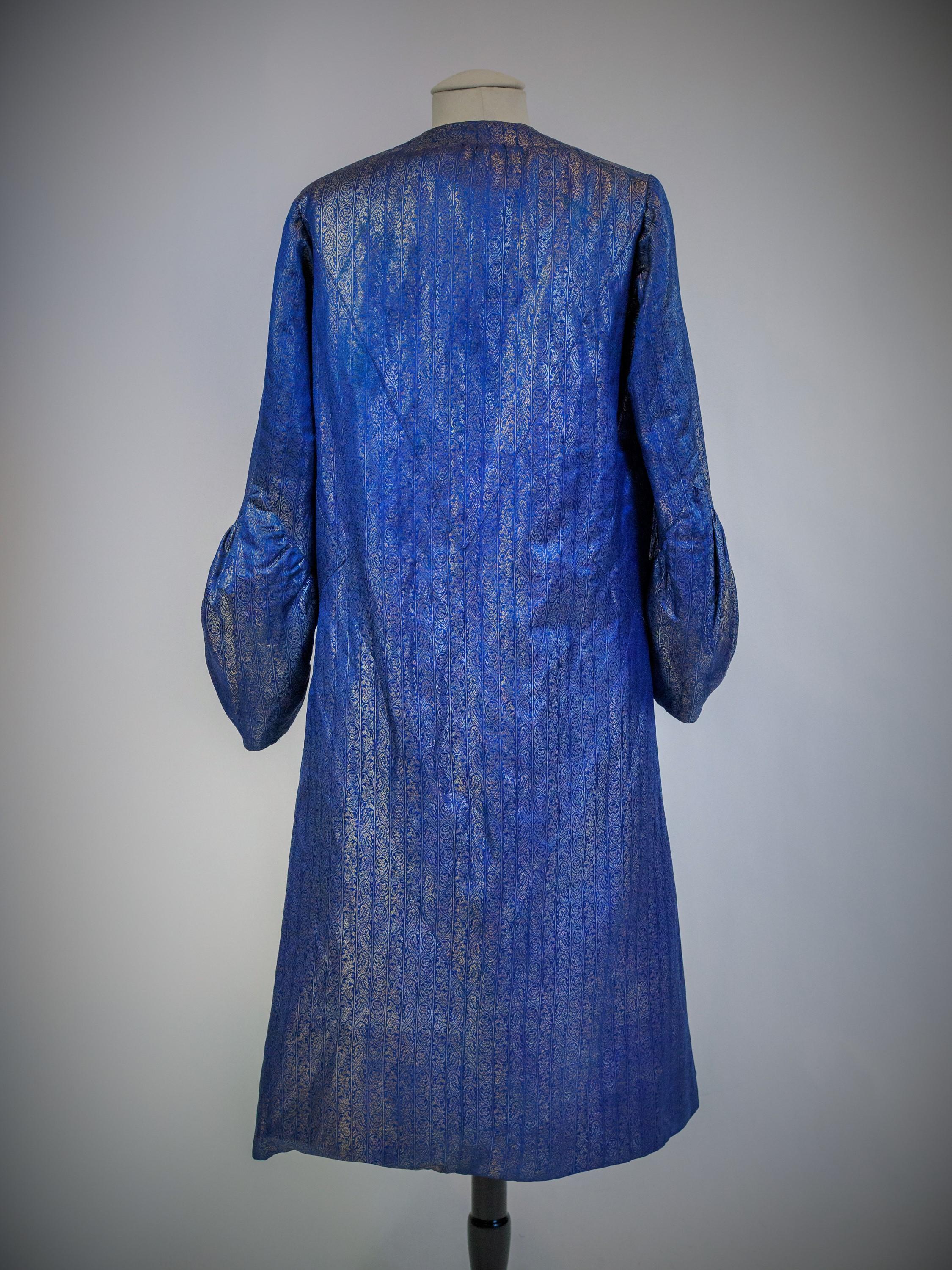 Blue Evening Couture coat in silver lamé by Germaine Lecomte N°03871 Paris Circa 1930 For Sale