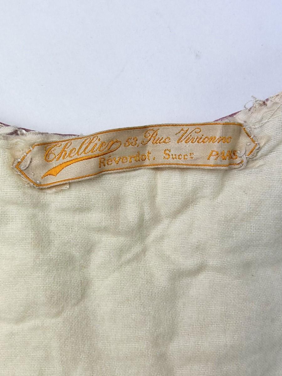 Circa 1905-1915
France
An evening coat by Chellier in Paris, an interesting piece of fashion history from this period. A long coat in cream wool felt with a crew neck, long puffed sleeves and a full skirted hem. Bobbin embroidery, inlaid and