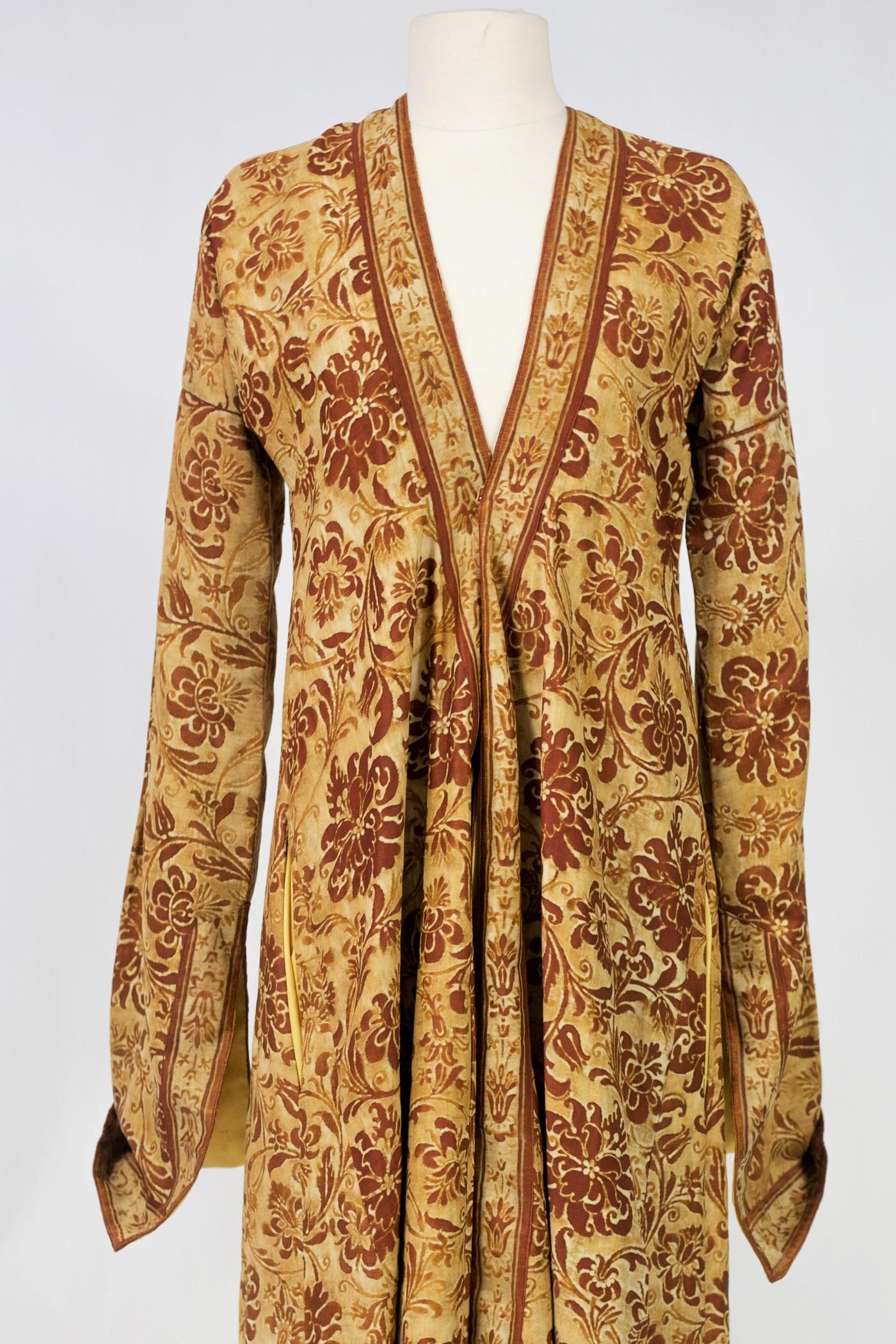 Circa 1950

Europe or Middle East

Elegant evening or interior coat in Kaftan cut made in a printed fabric by Mariano Fortuny Venice circa 1950. Straight cut, long and slit at the cuffs and at the bottom of the coat. Two side slit pockets. Cotton
