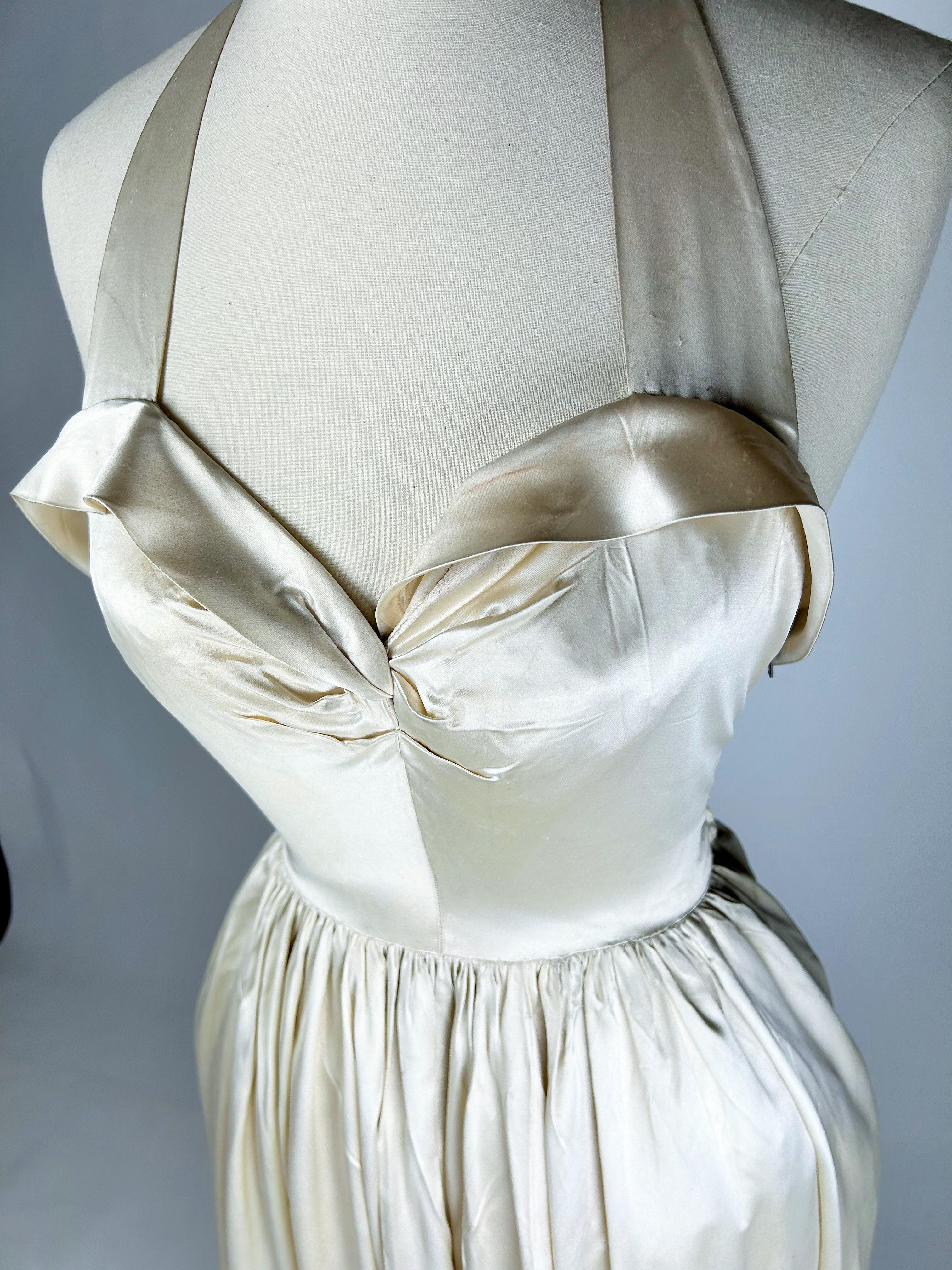 Evening dress by Lucien Lelong Couture in embroidered champagne satin Circa 1942 1