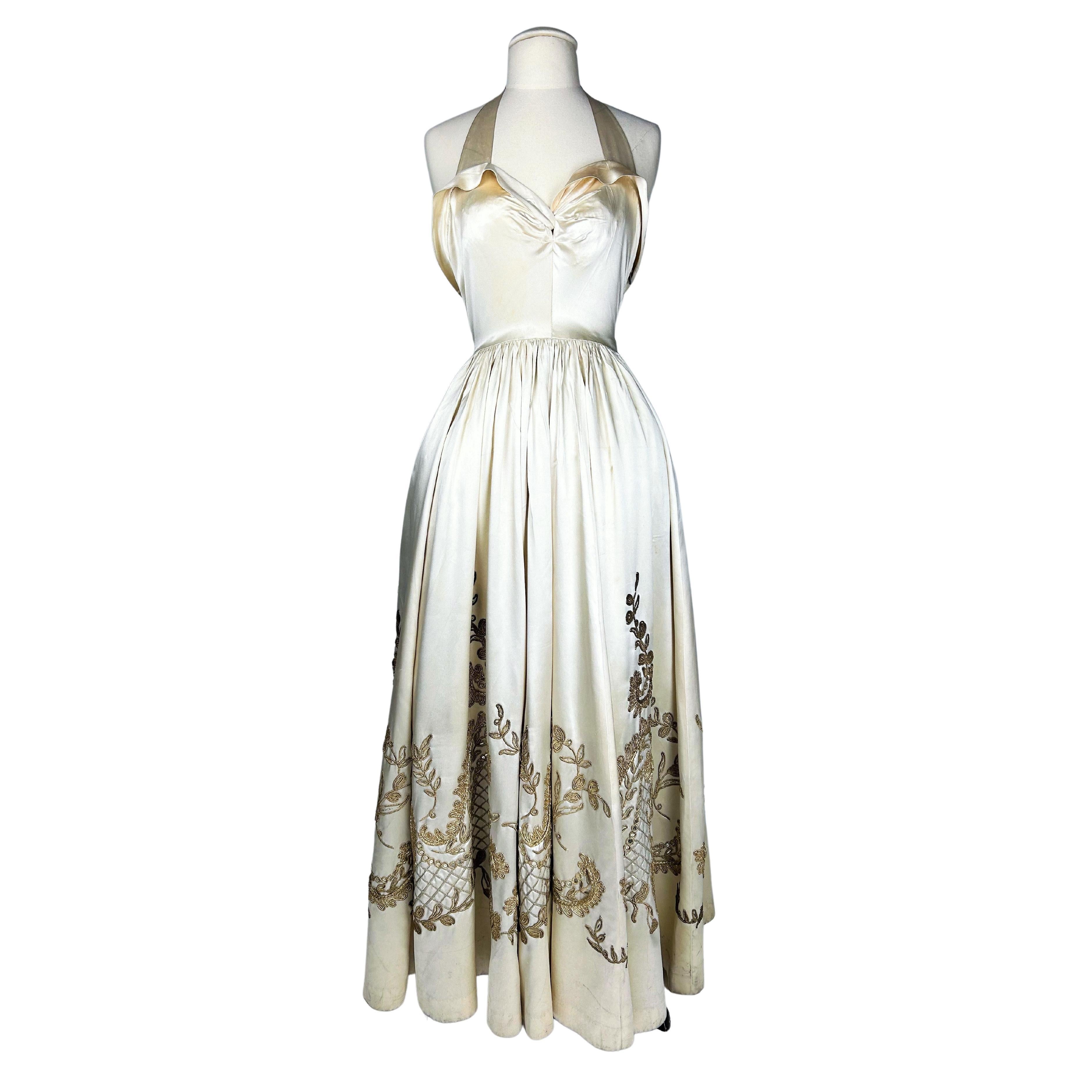 Evening dress by Lucien Lelong Couture in embroidered champagne satin Circa 1942
