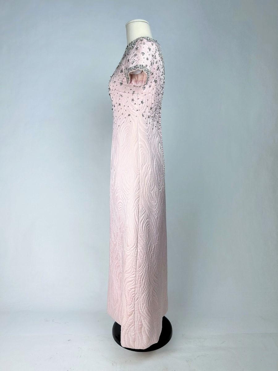 Autumn Winter 1967 Collection

Paris

Evening dress by Yves Saint Laurent Haute Couture (attributed to) dating from the famous Autumn Winter 1967 collection. Long jewellery dress with chasuble cut, crew neck, short sleeves and zip at the back.