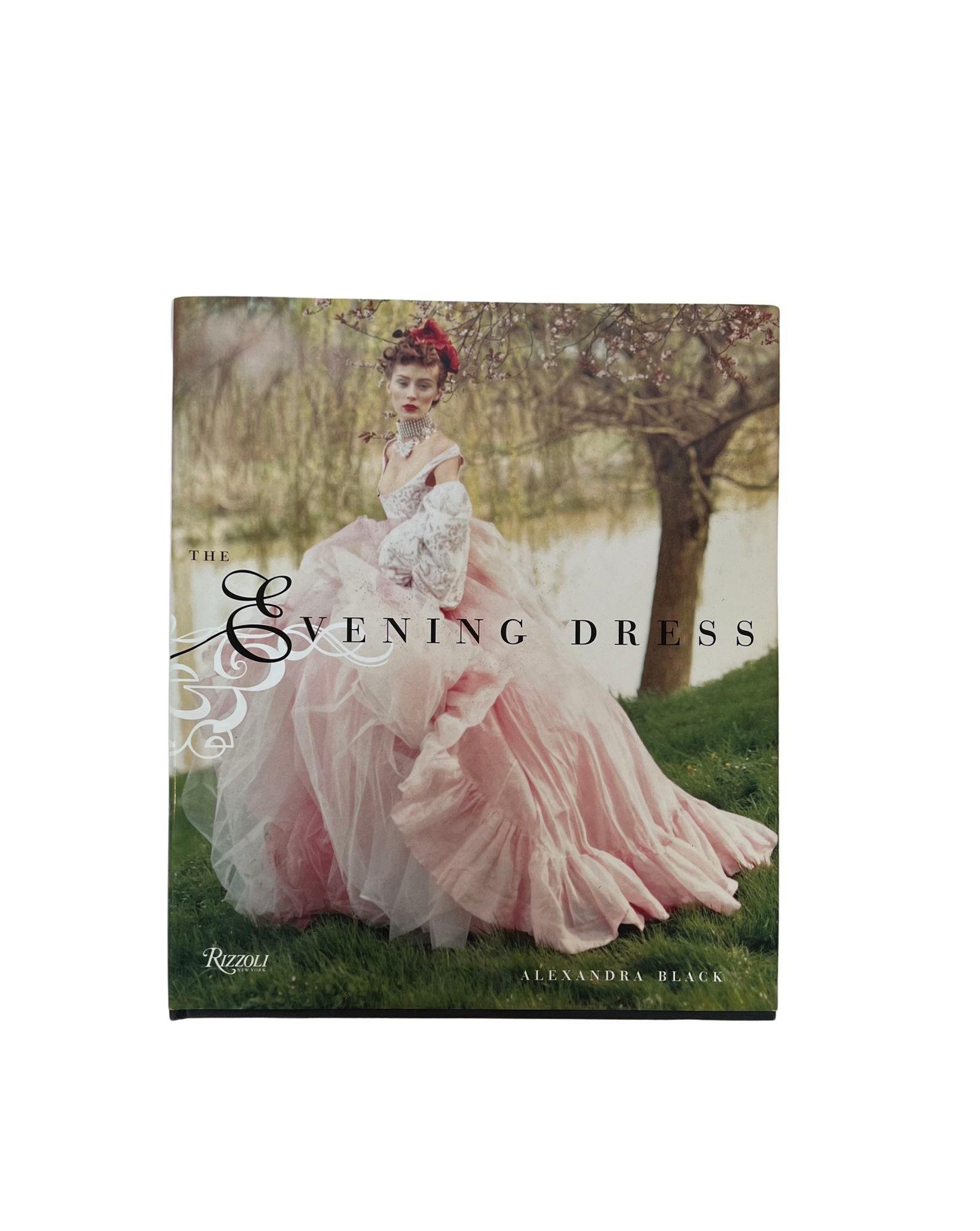 Evening Dress Hardcover Book First Edition of 2004, By Alexandra Black is a tribute to the most elegant form of the fashion arts chronicles.The book is an entire journey through the evution of glamorous evening attire from ancient times to the