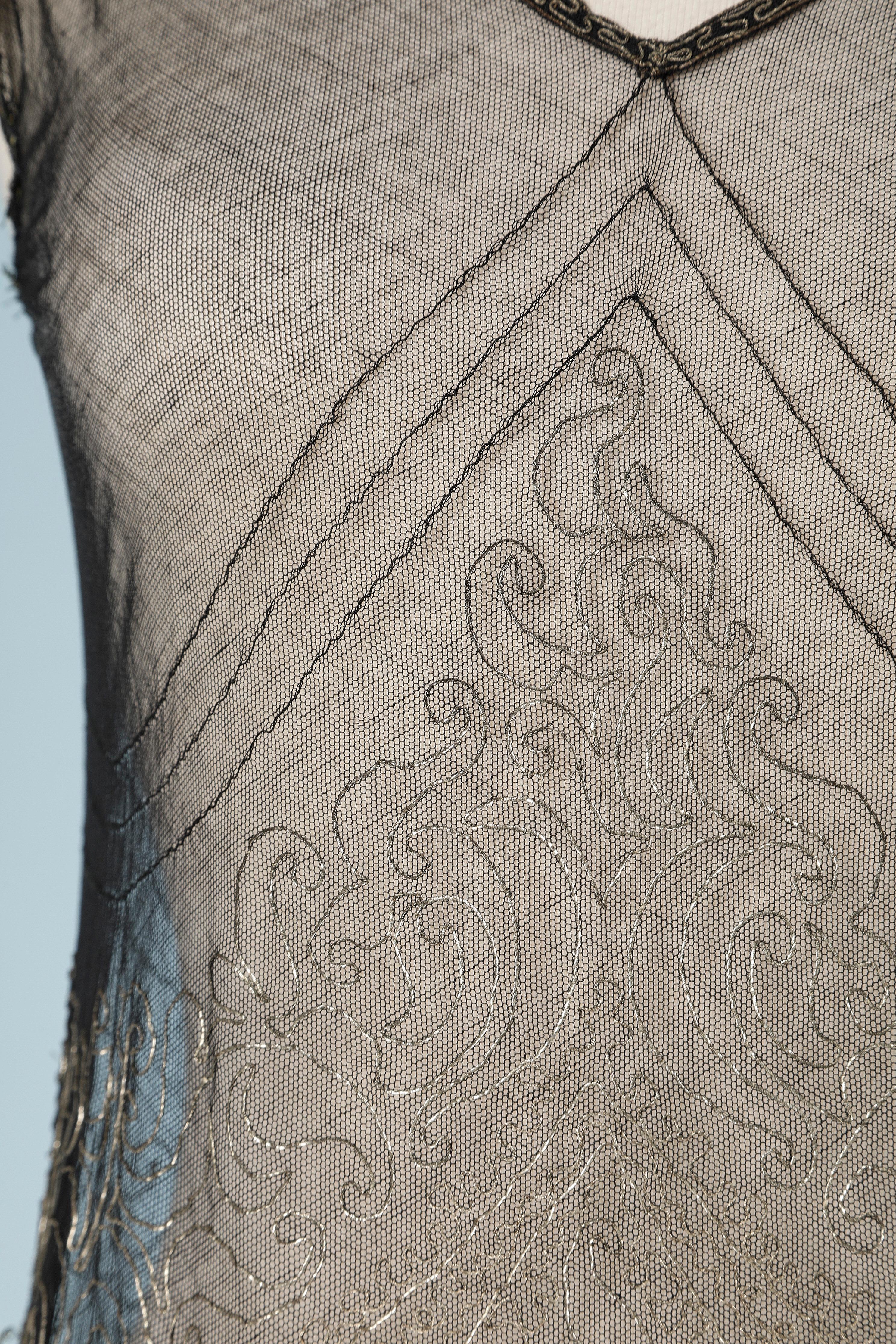 Evening dress in black tulle with lurex thread and flower basket embroideries.
Circa 1925