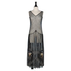 Evening dress in black tulle with lurex thread and flower basket embroideries 