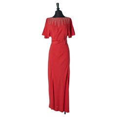Evening dress in red crêpe with beadwork neckline and bow-belt  Circa 1930's 