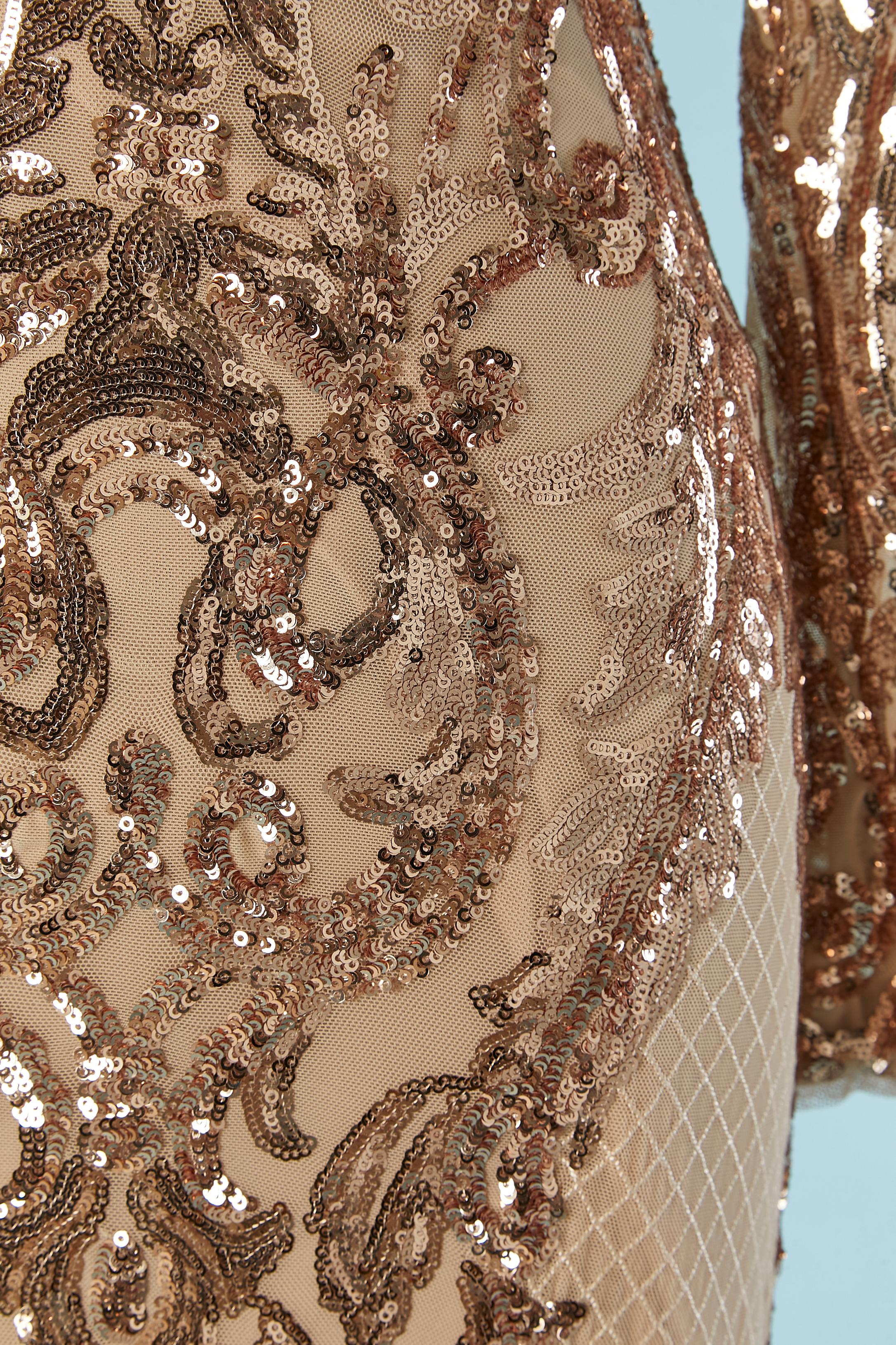 Evening dress with copper sequins on tulle base. Main fabric composition: 95% nylon, 5% spandex. Lining: 100% polyester jersey. 
Hidden zip closure in the middle back and hook&eye. 
SIZE 4 (US) XS 
