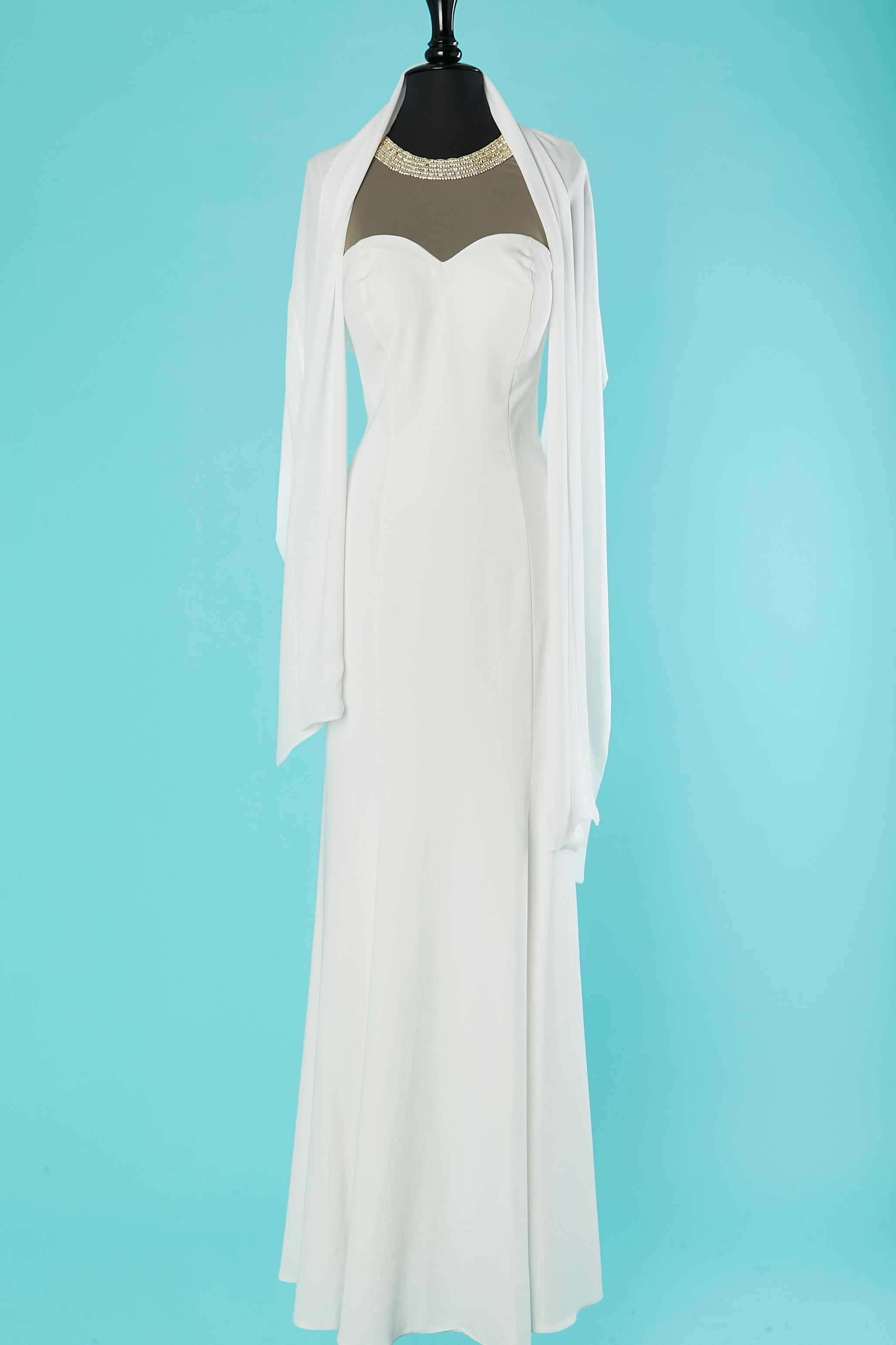 White evening dress with rhinestone neckless neckline front and back and shawl  ( 50cm X 200 cm) . Fabric composition: 100% polyester. 
Invisible zip on the left side. Padded bra. Button, buttonhole and hook&eye on the top of the left shoulder.