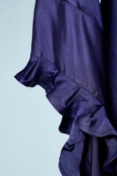 Evening dress with train in deep purple satin and long sleeves