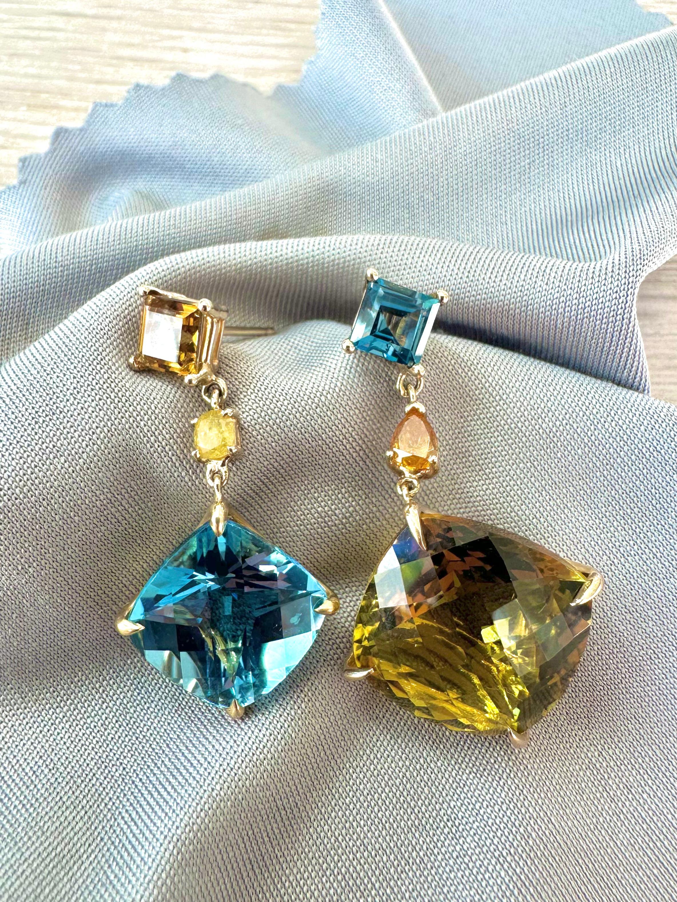 Citrine Topaz Yellow Diamond 18k Gold Drop Earrings by Kristin Hanson. Evening Primrose earrings are designed to accentuate individuality with magnificent shades of golden citrine and London blue topaz. Delicate yet strong, these drops sparkle in