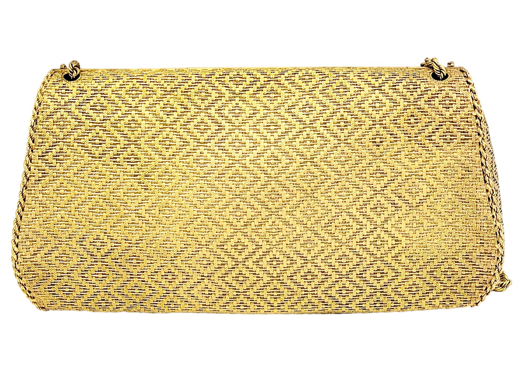 Exquisite 18 karat yellow gold evening purse. This gorgeous and unique bag is composed of delicate woven 18 karat yellow gold arranged in a subtle diamond shaped zigzag pattern. There are .40 carats of pave white diamonds embellished on the 2
