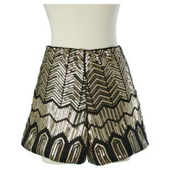 Evening short covered with gold sequins and black beads Saint Laurent 