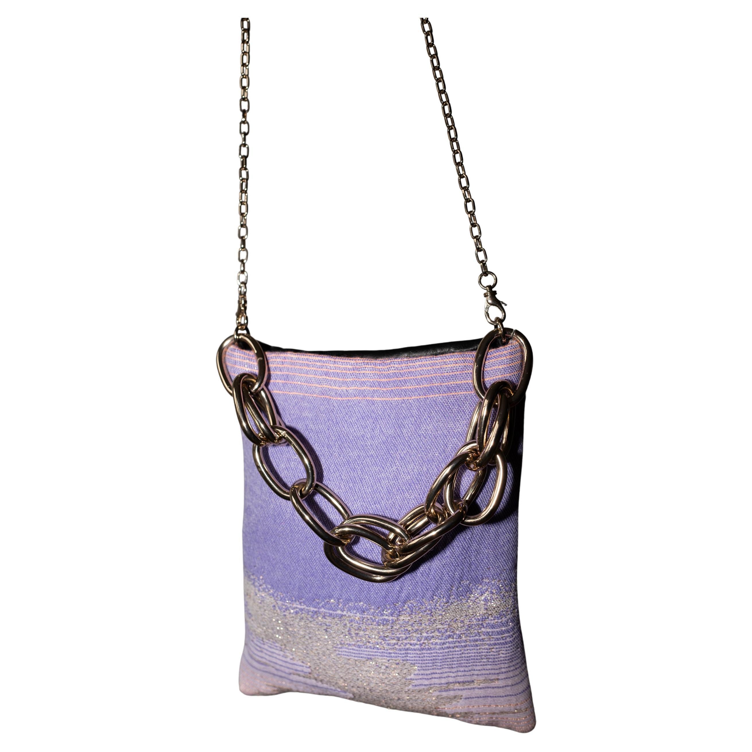 One of a kind Evening Shoulder Bag French Pastel Lilac Pink Lurex Fabric on one side and on the other Italian Black Leather, Italian Gold Plated Brass Shoulder Chain Detachable  and Chunky Gold Chain Handle J Dauphin

Size: Height 21 cm, Width 17