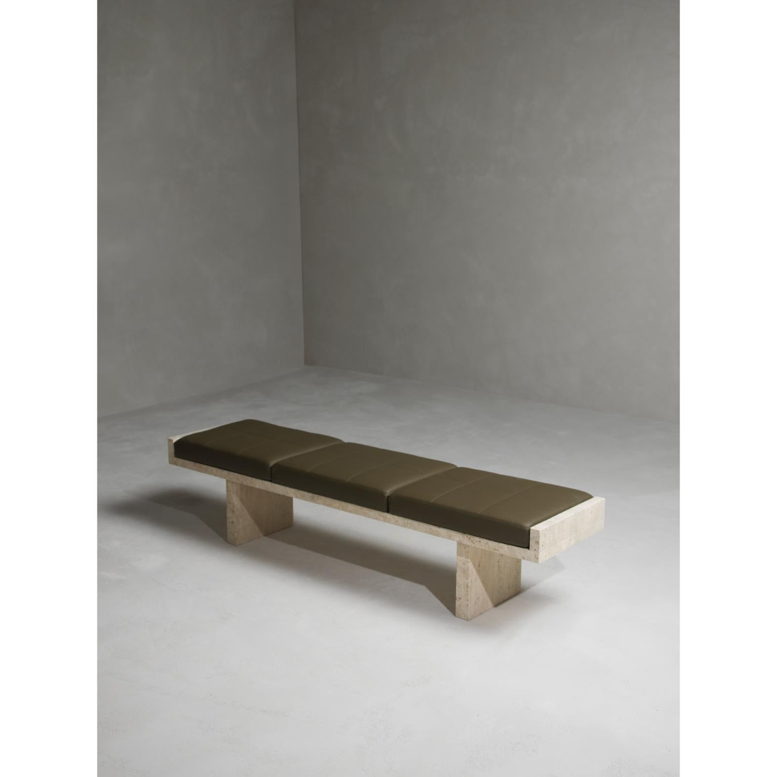 Ever Bench by Kreoo 
Designed by Christophe Pillet
Dimensions: D 45 x W 190 x H 43 cm.
Materials: Travertino Paglierino and leather.

Available in different marble and travertine options. Please contact us.

The softness of pebbles worked by the