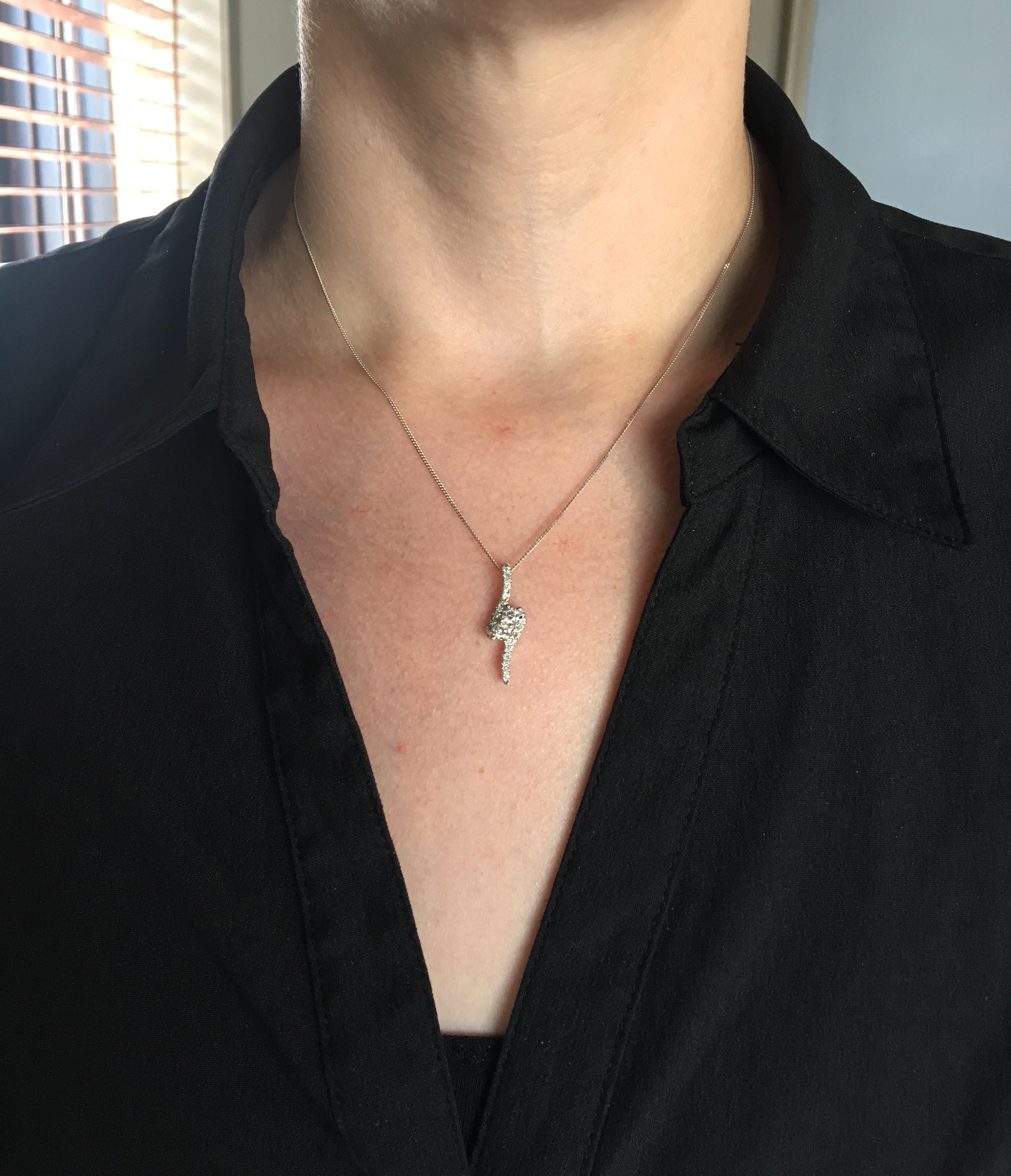 Ever Us bypass style diamond pendant necklace crafted in 14k white gold.

Total Diamond Carat Weight: Approximately .50CTW
Diamond Cut: Round Brilliant Cut
Color: Average G-I
Clarity: Average SI-I
Metal: 14K White Gold
Marked/Tested: Stamped “Ever