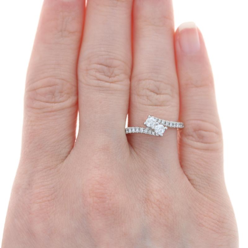 Retail Price: $1,849

Size: 6 3/4
Sizing Fee: Down 1 size for $60 or up 2 sizes for $70

Brand: Ever Us

Metal Content: 14k White Gold

Stone Information (engagement ring)
Natural Diamonds
Carats: 1/2ctw
Cut: Round Brilliant
Color: H - I
Clarity: