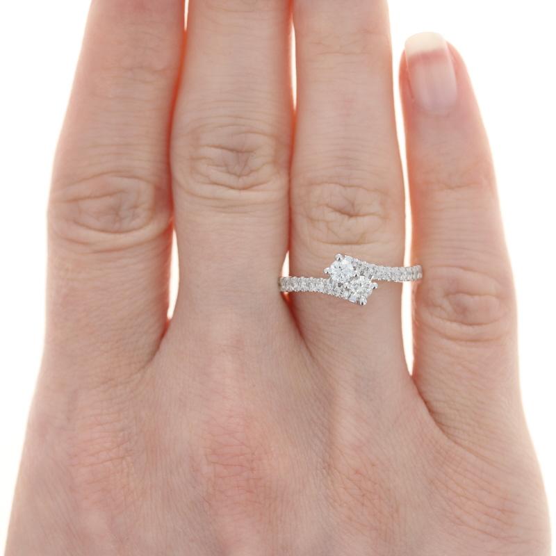 Originally retailing for $1200, this elegant designer ring is being offered here for a much more wallet-friendly price.

Size: 7
Sizing Fee: Down 1 size or Up 2 sizes for $30

Brand: Ever Us

Metal Content: 14k White Gold

Stone Information:
Natural