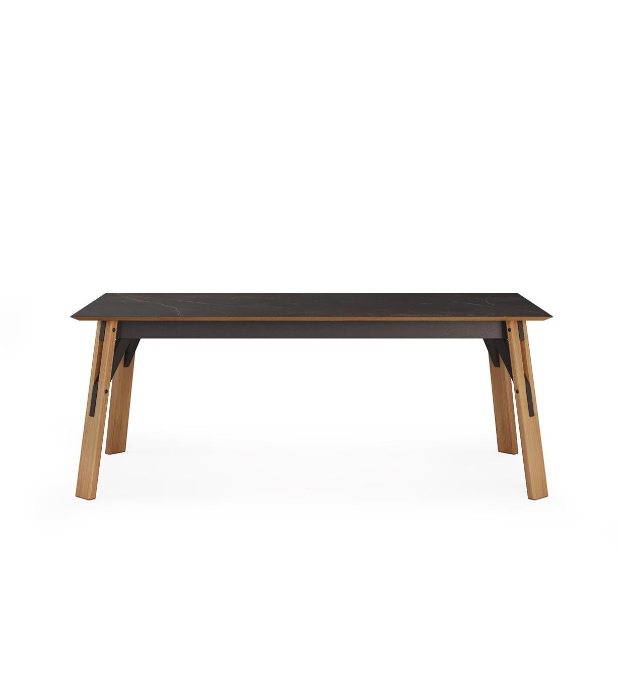 A classic design with modern details. The shape of the table expresses a complicated simplicity with geometric forms. With an extensible top, the table offers plenty of space for large gatherings. Sits comfortably 6 (+4) people. 