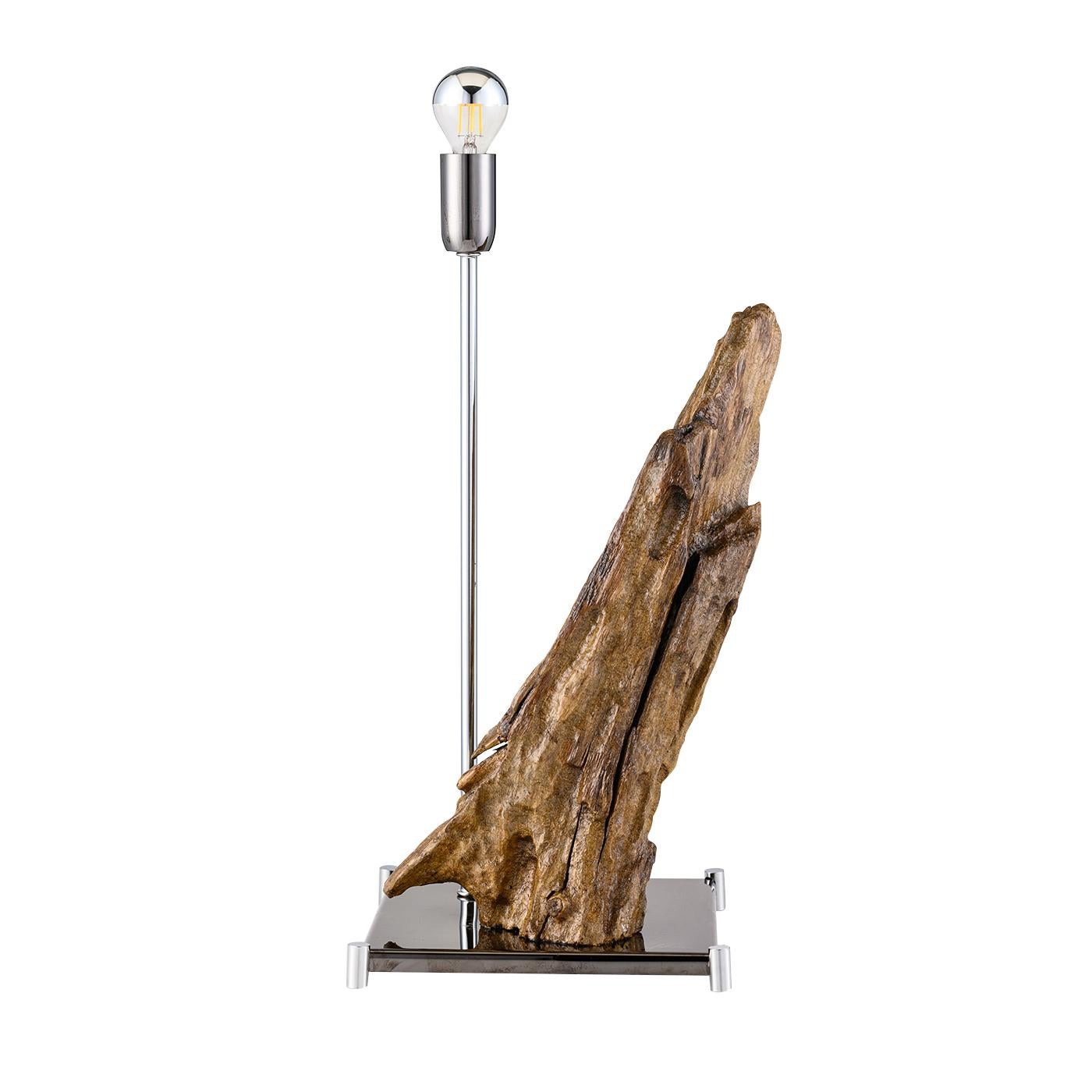 The stunning Everest lighting sculpture, featuring sea wood from the Amalfi Coast, is both sophisticated and unique in design. Sitting atop a reflective black stainless steel base with gold brass feet, the unique wood sculpture provides an