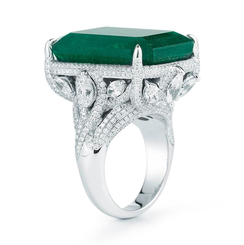 EVERGREEN EMERALD & DIAMOND RING
A sensational deep green Emerald with an elegant platinum and pear shaped diamond setting.

 Item:	# 01828
Setting:	18K W
Lab:	        C.Dunaigre
Color Weight:	32.77 ct. of Emerald
Diamond Weight:	5.77 ct. of Diamonds