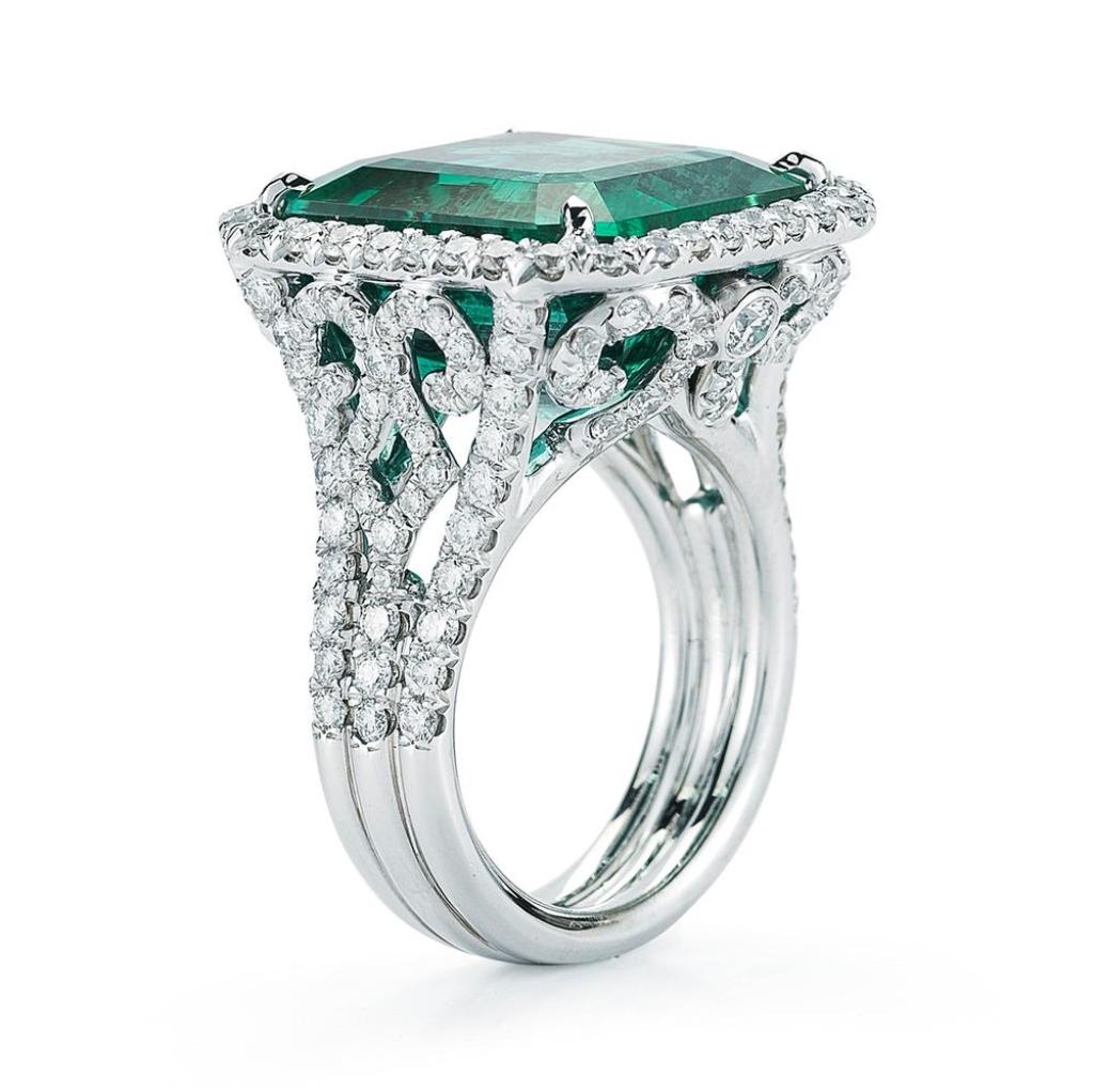 EVERGREEN EMERALD RING A swirl shaped design compliments the beauty of this 17 ct Octagon cut Emerald Item: # 01925 Metal: 18k W Lab: Gia Color Weight: 17.39 ct. Diamond Weight: 2.39 ct.
