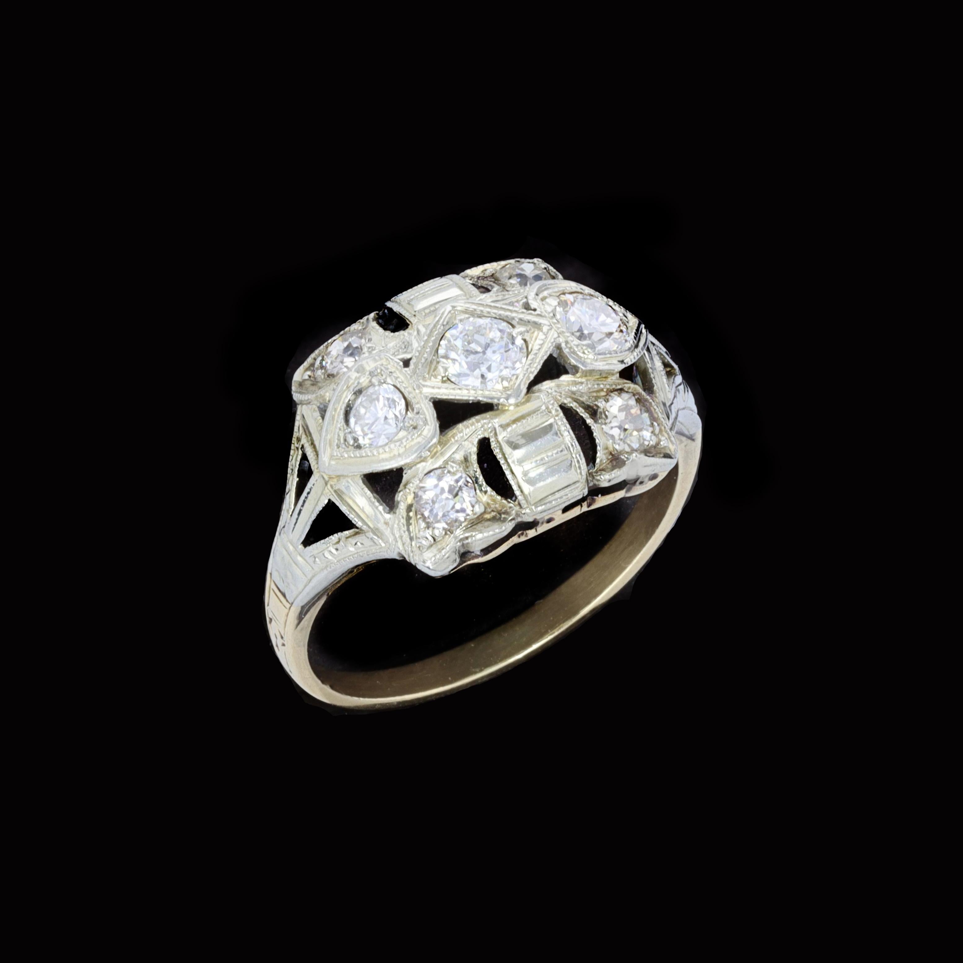 Turn heads with this turn of the 20th century Edwardian diamond 14K yellow gold ring set with seven old mine cut diamonds.The diamonds weigh approximately 0.40ctand the entire ring weighs 2.3 grams. Size 4 3/4

